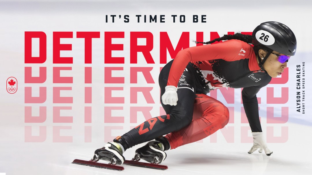 Short track speed skater in a lean on ice