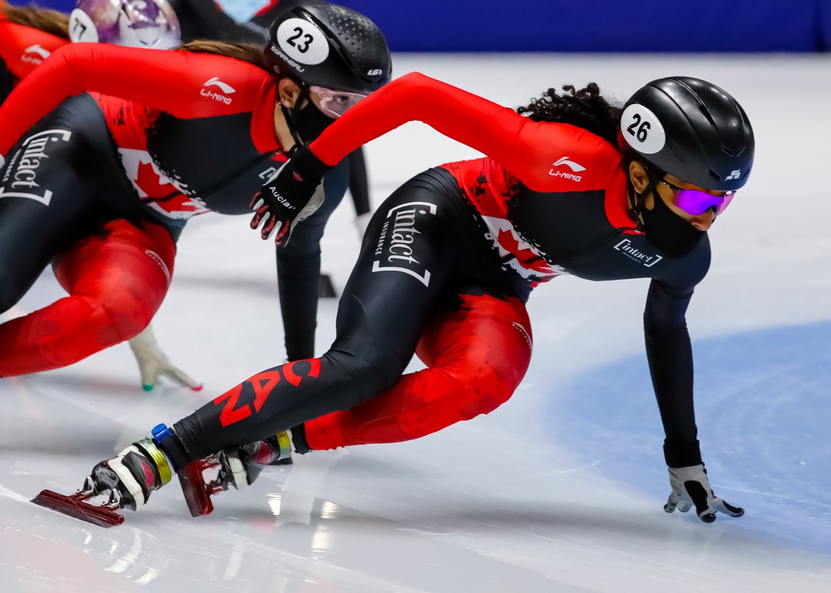 Alyson Charles wears a mask while training on ice