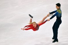 Man swings female partner in ice dance