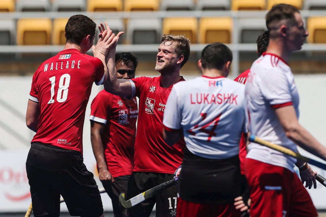Bissett Brenden, center, of Canada celebrate his goal with this team mate during a game against Belarus at the FIH Series Final in Kuala Lumpur, Malaysia, Monday, April 29, 2019. (AP Photo/Annice Lyn)