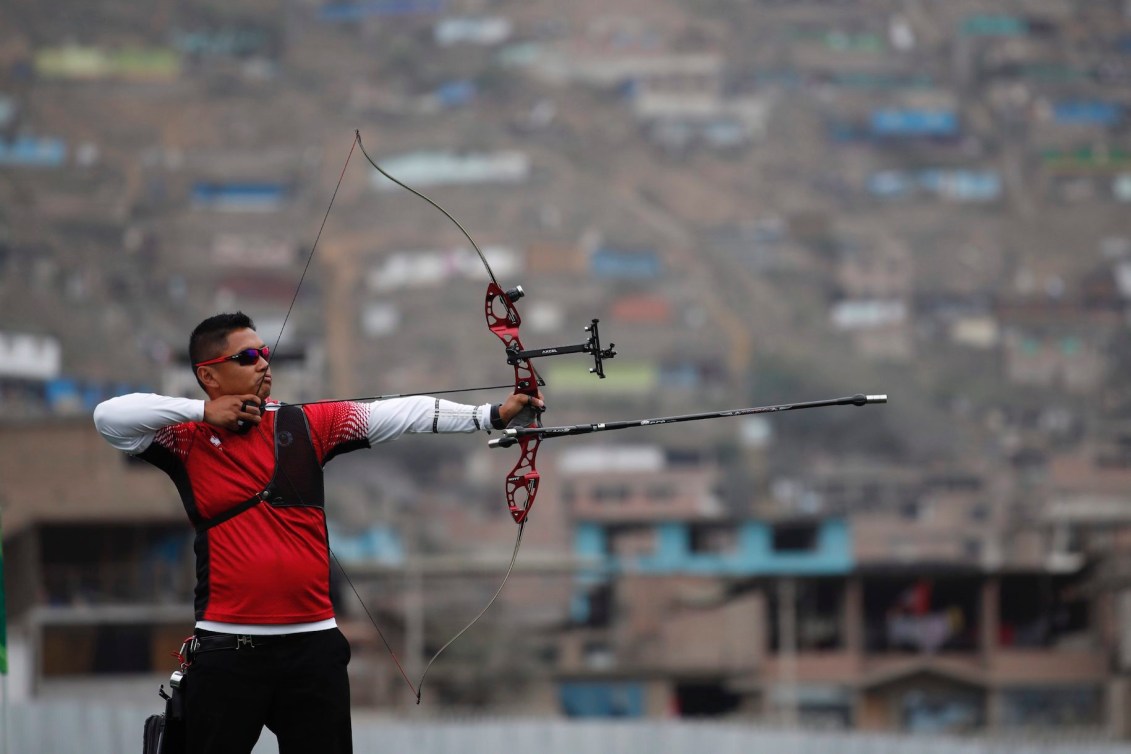 Crispin Duenas of of Canada competes to win the gold medal in the men's archery recurve individual final against Marcus Dalmeida at the Pan American Games in Lima, Peru, Sunday, Aug. 11, 2019. (AP Photo/Moises Castillo)