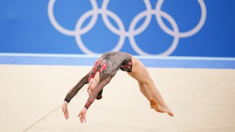 Ava Stewart performs a back flip in floor exercise