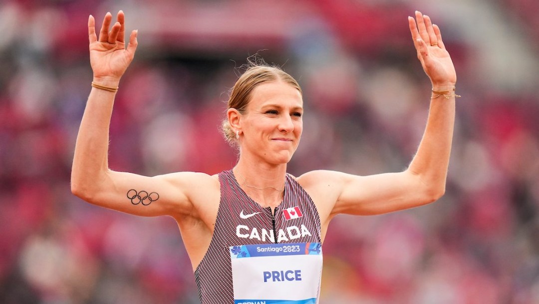 Maddy Price raises her hands to the crowd in celebration