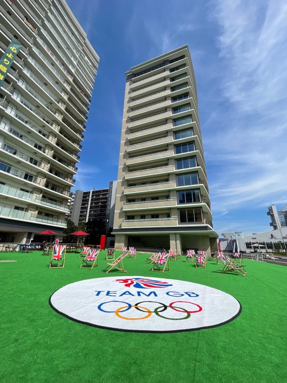 Apartment style multi-floor building with Team Australia and Team Great Britain identifiers on the outside