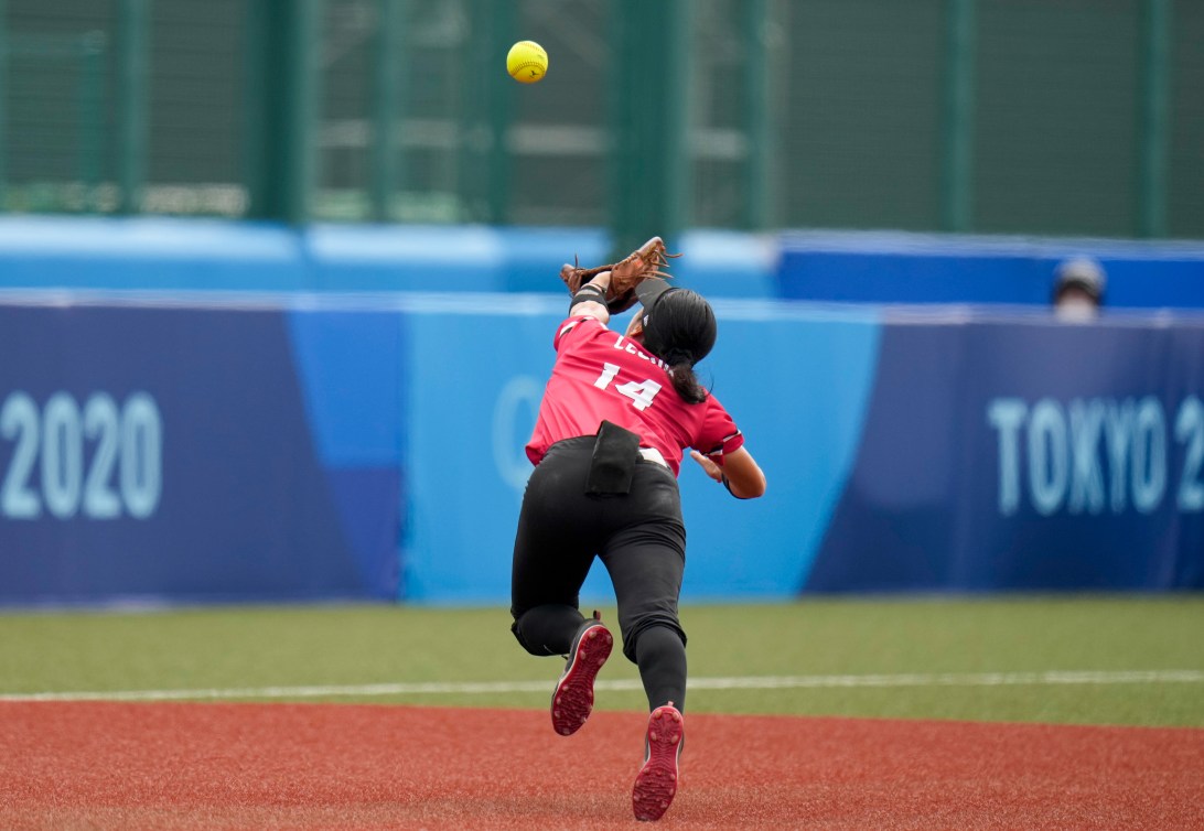 Team Canada's Janet Leung dives for a ball
