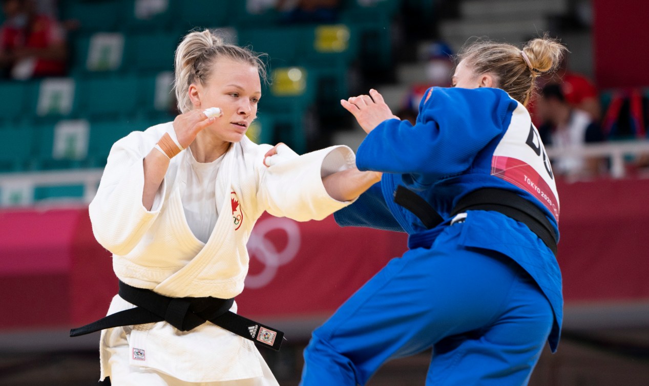 Canada's Jessica Klimkait reaches for opponent in the women's 57kg competition.