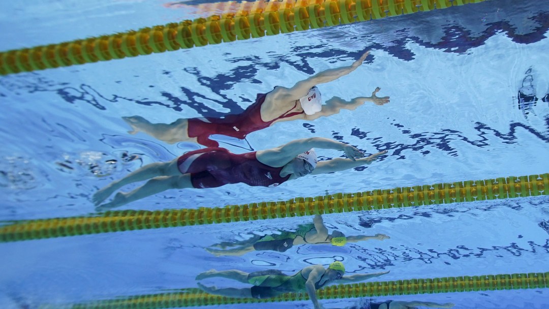 female swims under the water