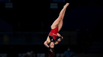 Celina Toth performs a twisting layout dive