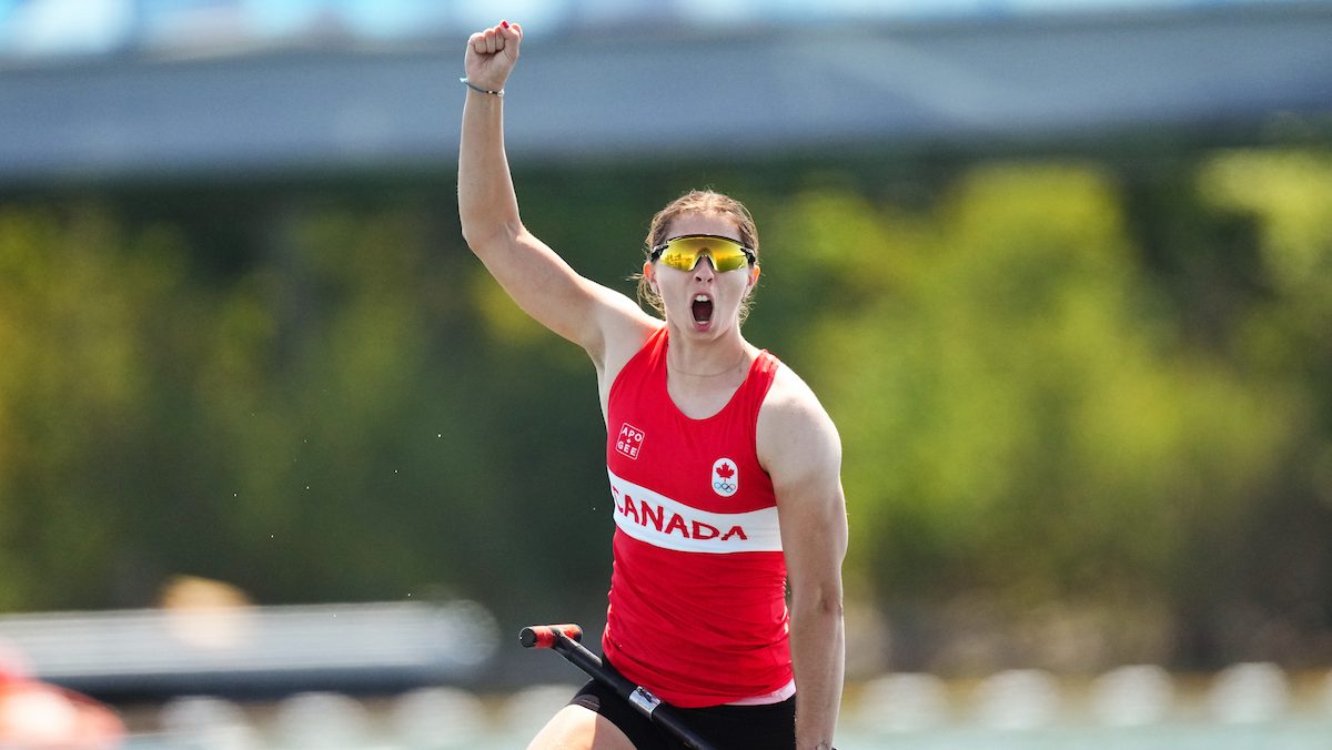 Katie Vincent raises her fist in celebration