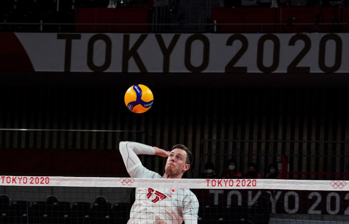 Canada's middle blocker Graham Vigrass #17 hits the ball against Italy during the menís preliminary round at Ariake Arena during the Tokyo 2020 Olympic Games on Saturday,July 24, 2021. Photo by Leah Hennel/COC 