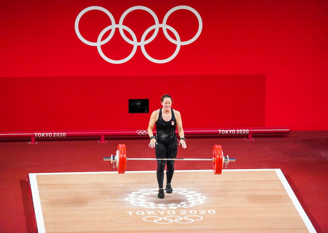 Maude Charron is overwhelmed with emotion as she drops the bar following her medal-clinching lift.