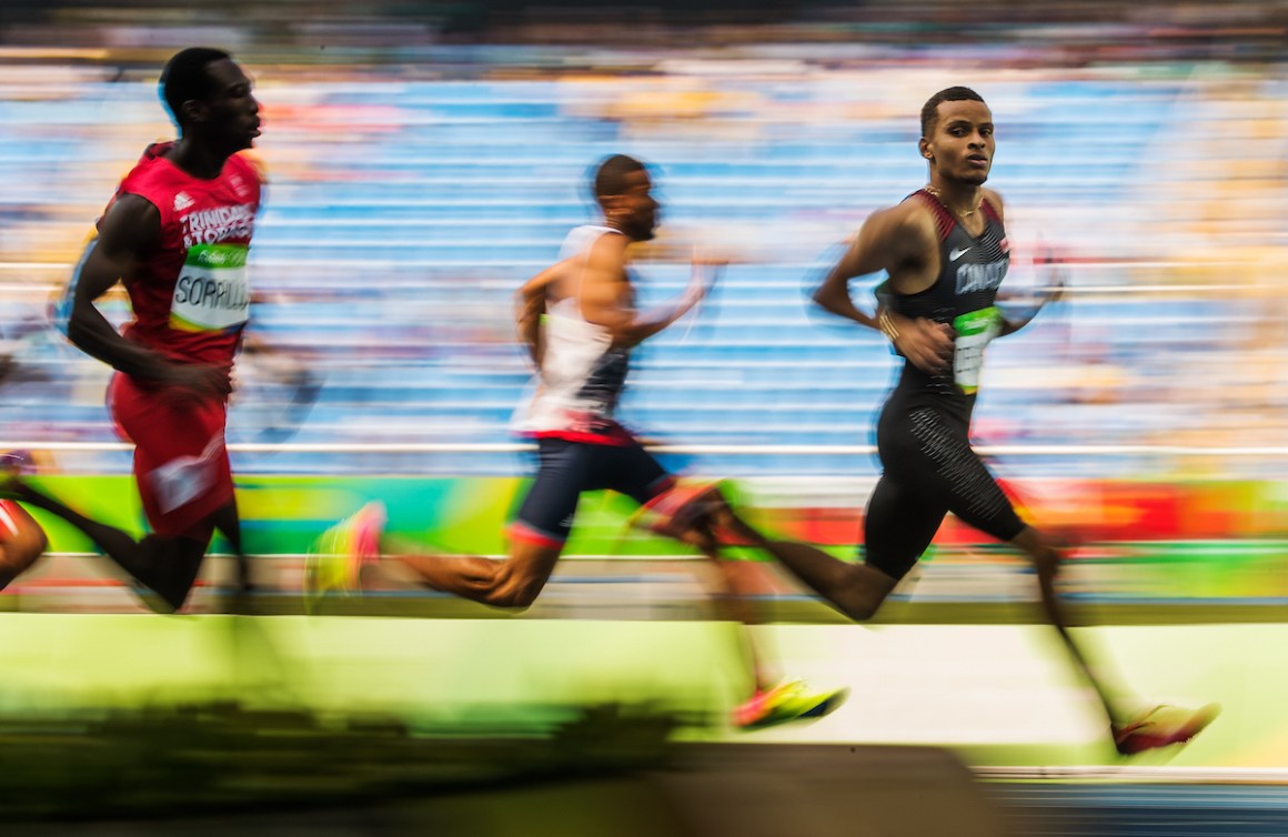 Andre De Grasse races across finish line