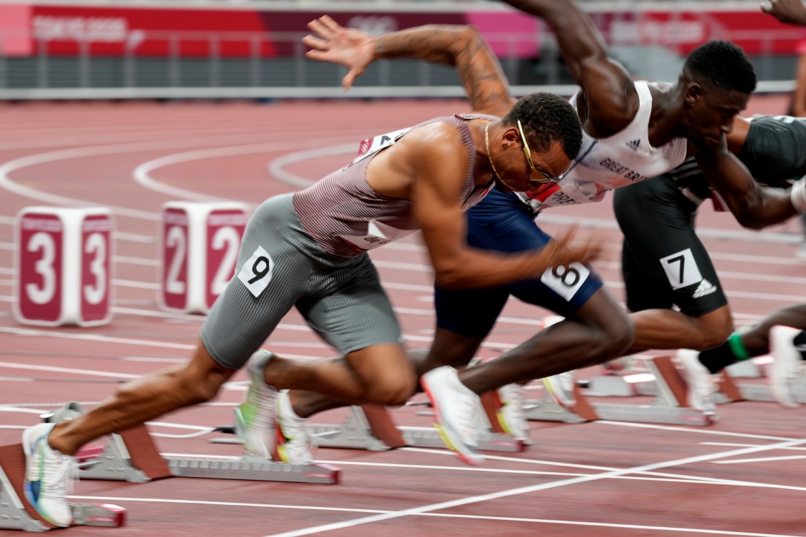 Andre De Grasse runs out of start blocks 