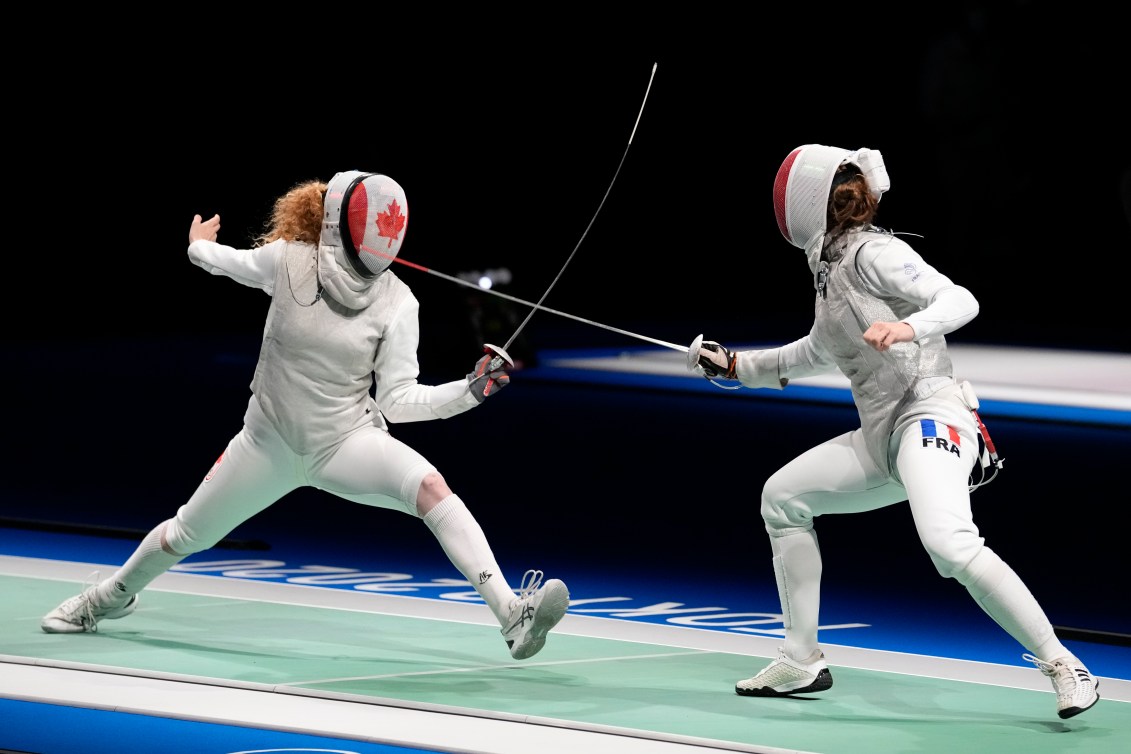Eleanor Harvey competing against France in fencing
