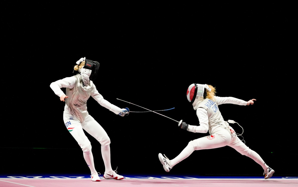 Two fencers in a match