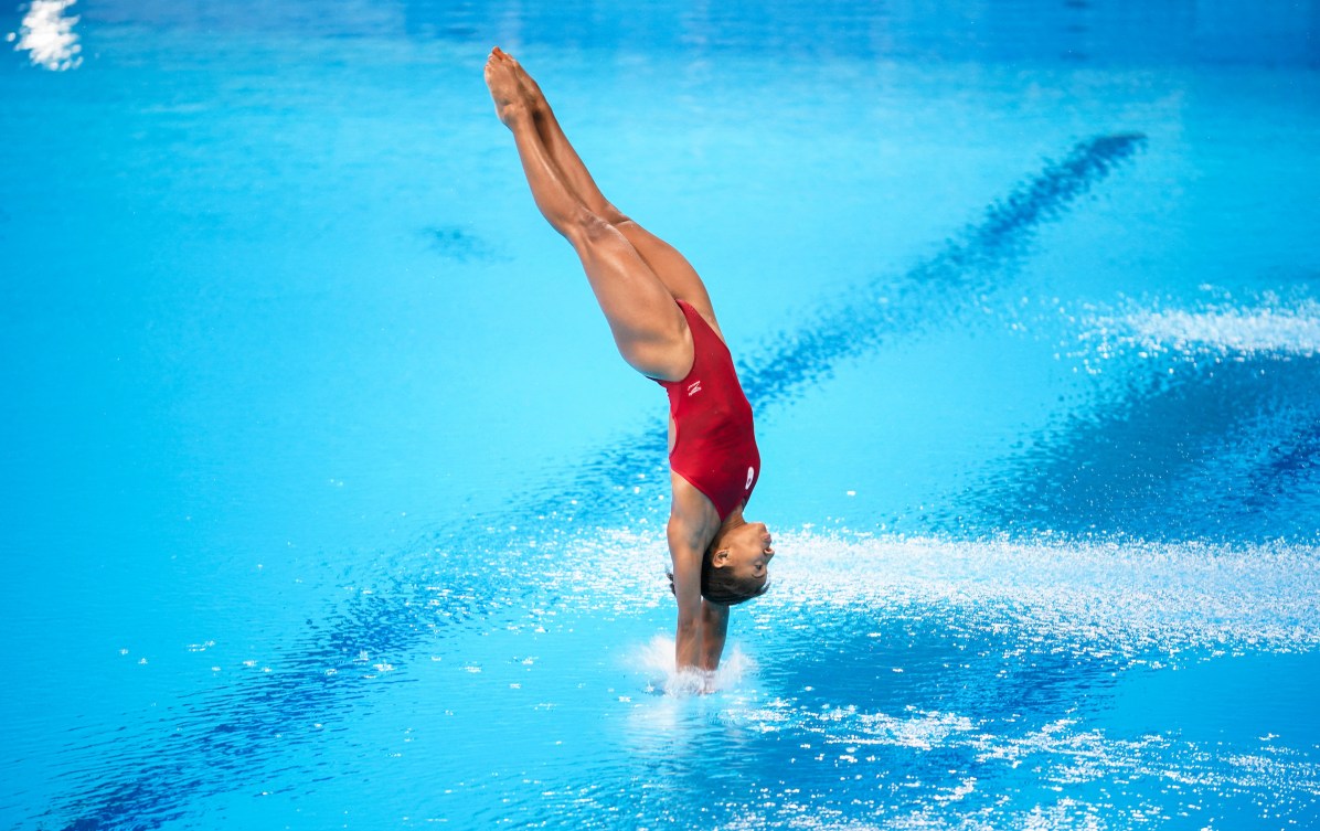 Jennifer Abel breaks the water on a dive 