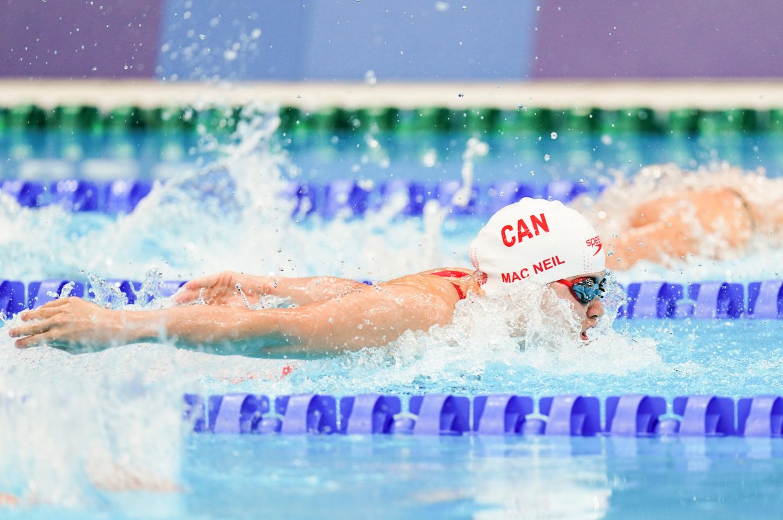 Maggie MacNeil swimming the 100m butterfly 