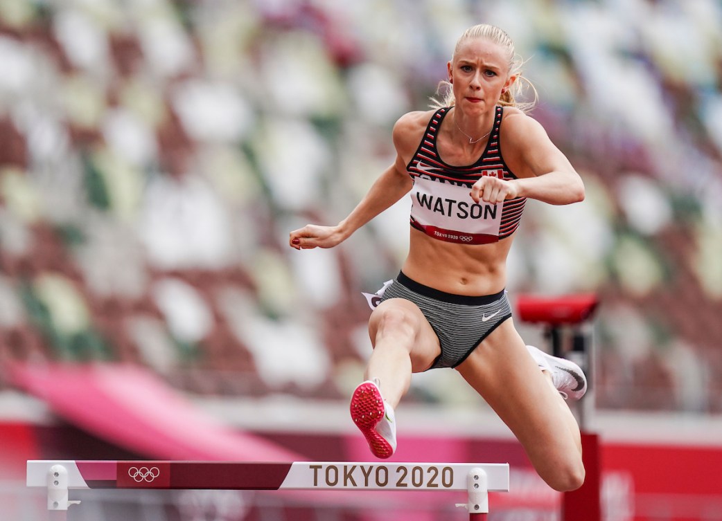 Sage Watson jumps over a hurdle in Tokyo 2020 Olympic Games.