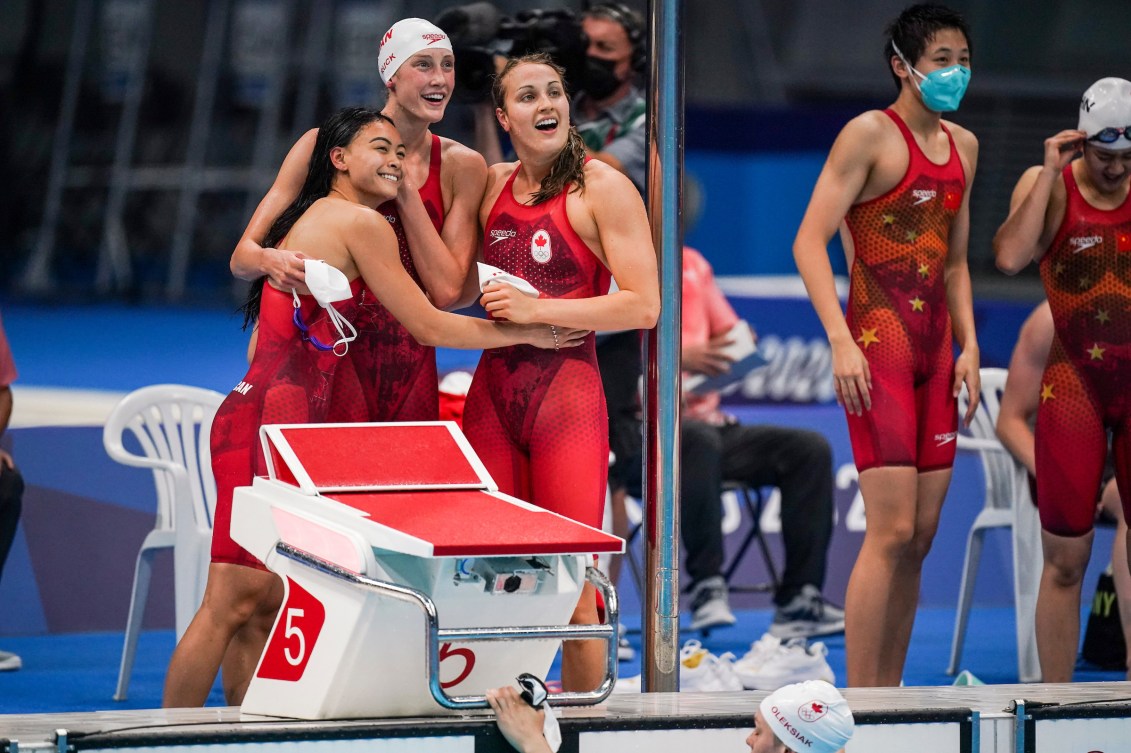 Relay swimmers celebrate on deck 