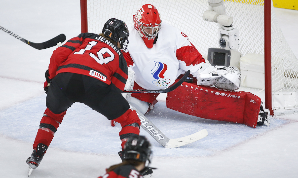 Russia's goalie Nadezhda Morozova, right, stops a shot from Canada's Brianne Jenner during first period IIHF Women's World Championship hockey action in Calgary, Alta., Sunday, Aug. 22, 2021. THE CANADIAN PRESS/Jeff McIntosh