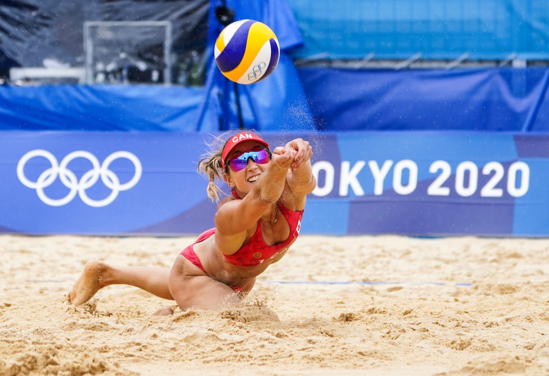 Canadian beach volleyball players Heather Bansley plays the ball
