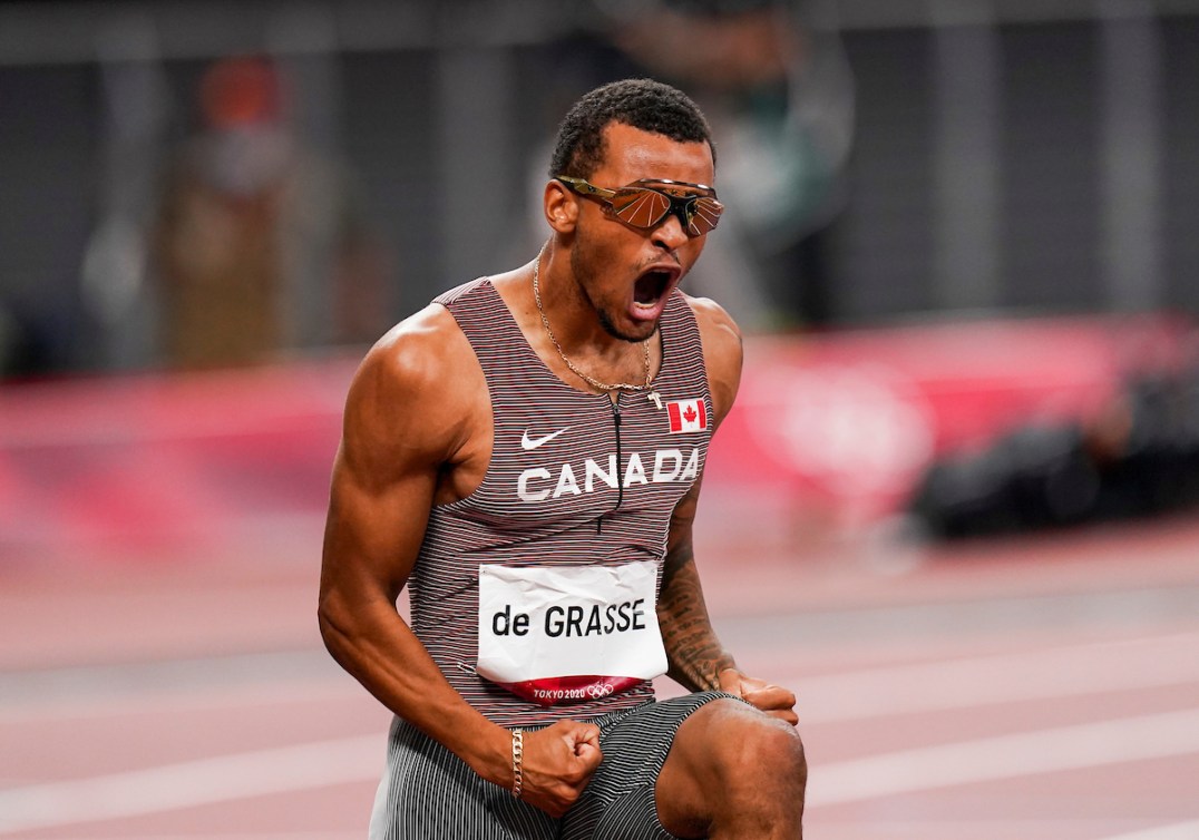 Andre De Grasse shouts as he wins gold in the men's 200-metre final