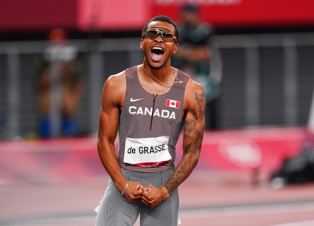 Andre De Grasse screams in celebration after winning 200m gold 