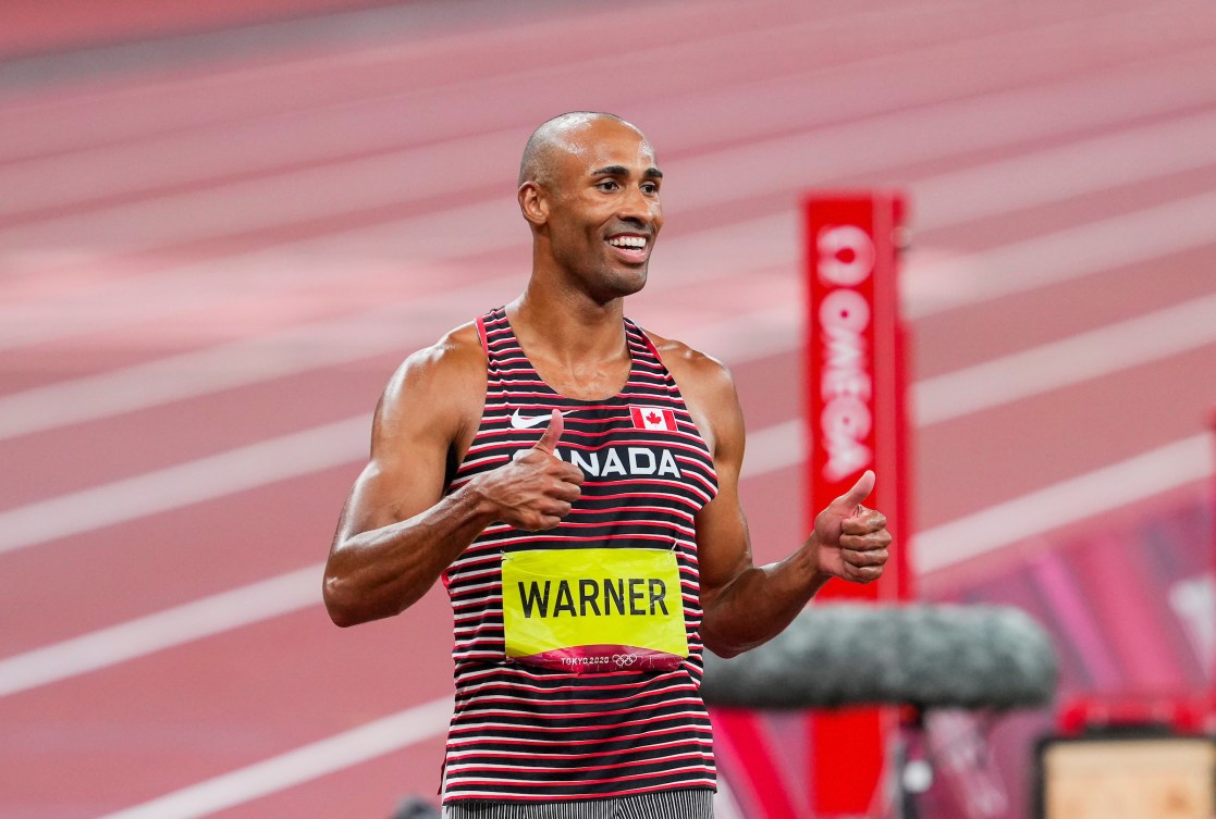 Damian Warner gives two thumbs up after winning decathlon