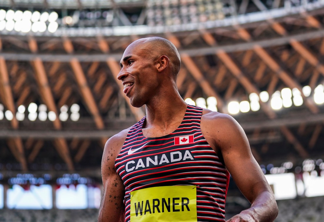 Damian Warner smiles while competing in the decathlon
