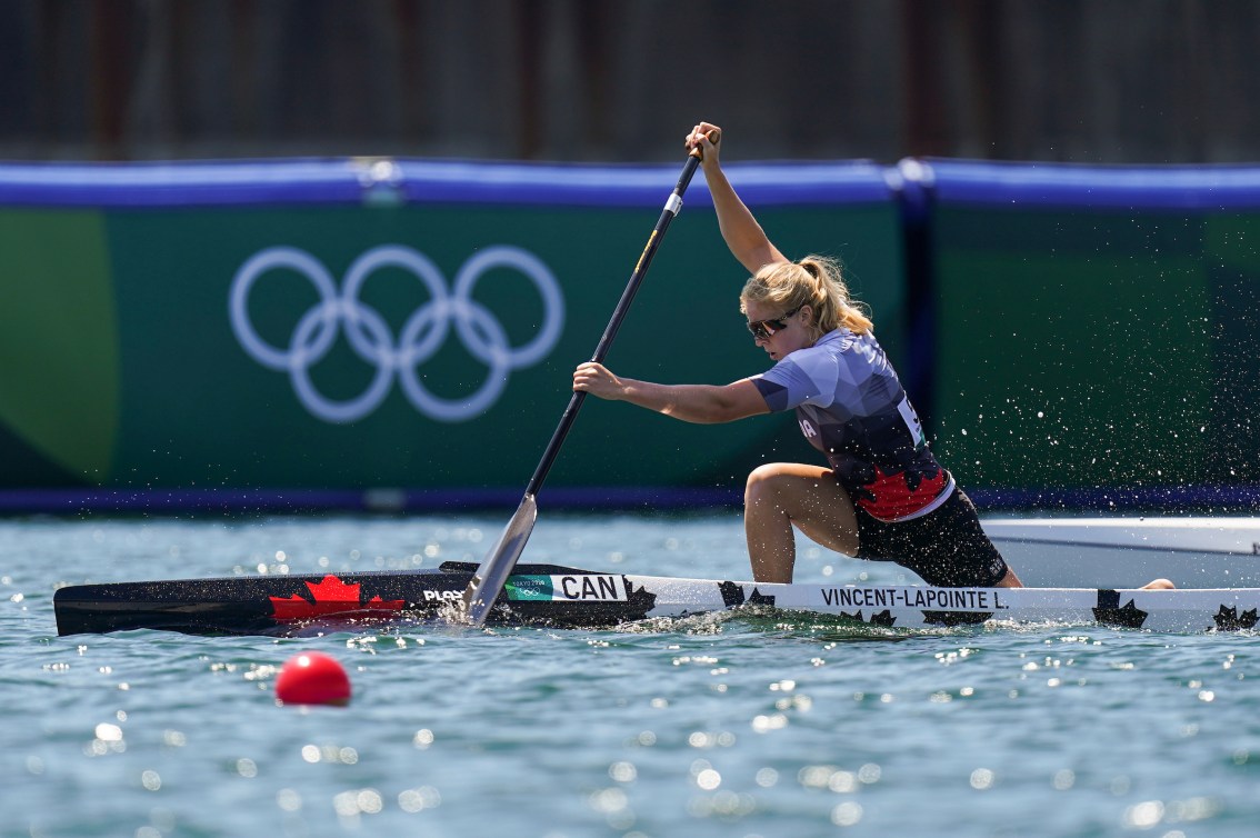 Laurence Vincent Lapointe paddles in a canoe