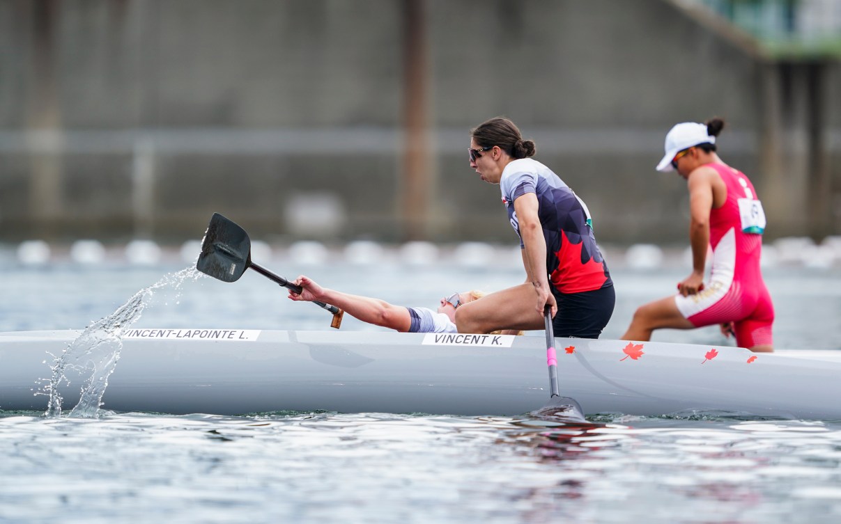 Laurence Vincent Lapointe falls out of the canoe in celebration