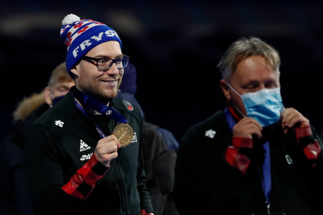 Laurent Dubreuil holds up his gold medal