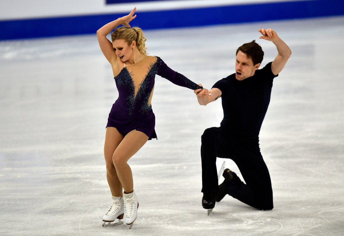Kirsten Moore-Towers and Michael Marinaro hit the end pose of their figure skating program 