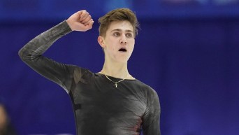 Roman Sadovsky pumps his fist at the end of his program