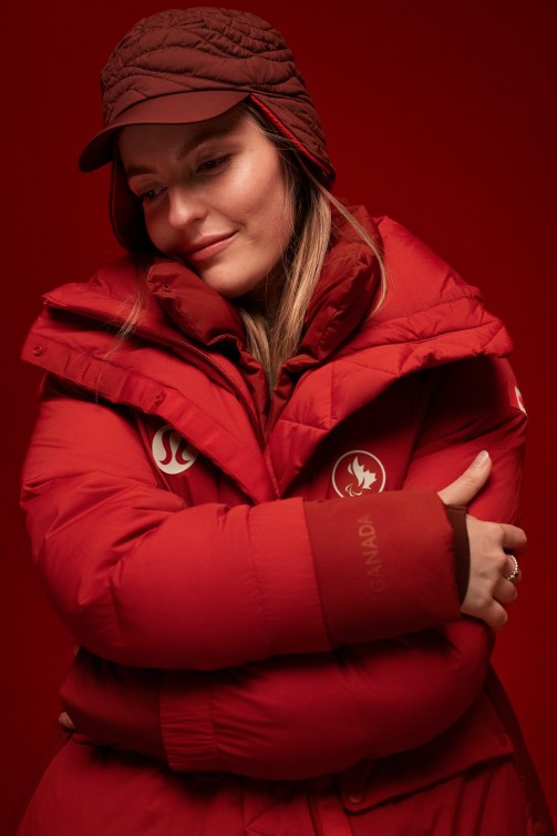 Frederique Turgeon wraps her arms around herself in a red parka