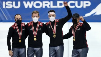 (Left to Right) Steven Dubois, Pascal Dion, Charles Hamelin, and Jordan Pierre-Gilles pose for a photo while wearing their gold medals.