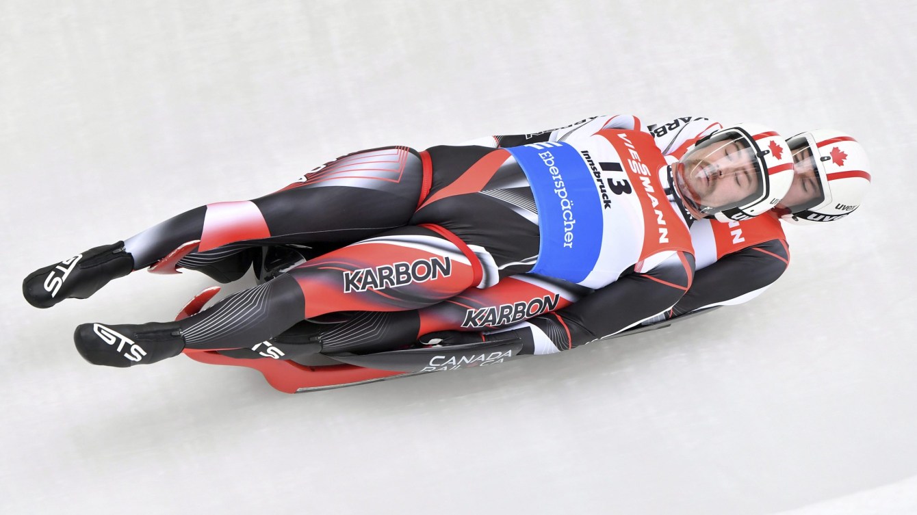 Tristan Walker and Justin Snith competing in a doubles luge race 