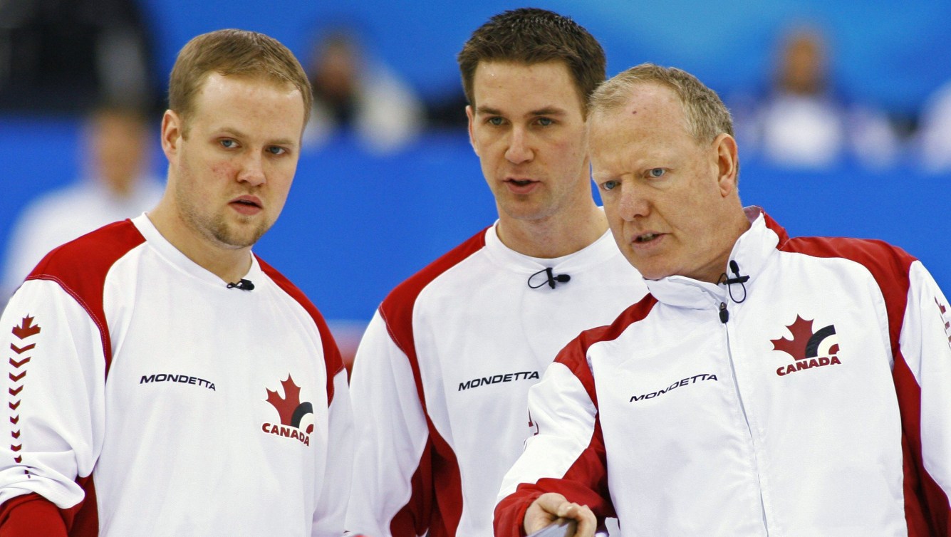 Mark Nichols, Brad Gushue and Russ Howard discuss a shot