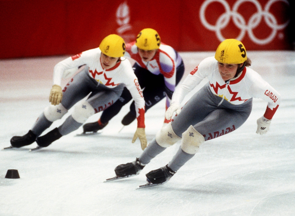 Canada's Annie Perrault (left) and Angela Cutrone (right) compete in the short track speed skating at the 1992 Albertville Olympic Winter Games.
