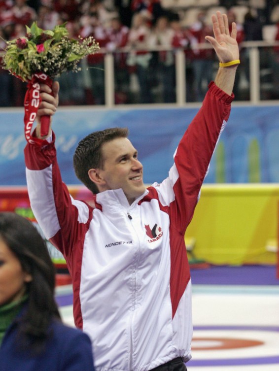 Brad Gushue of St. John's, N.L., waves to the crowd after his team won the men's curling gold medal at the Winter Olympics in Pinerolo, Italy, Friday, Feb. 24, 2006.