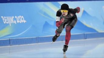 Alexa Scott skates towards the camera in a speed skating race