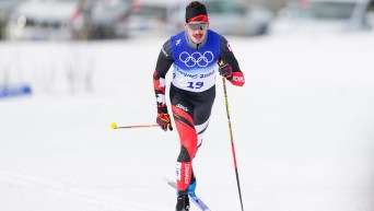 Antoine Cyr skis in classic technique in a cross country race