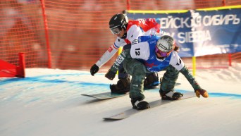 Audrey McManiman races another snowboarder down the course