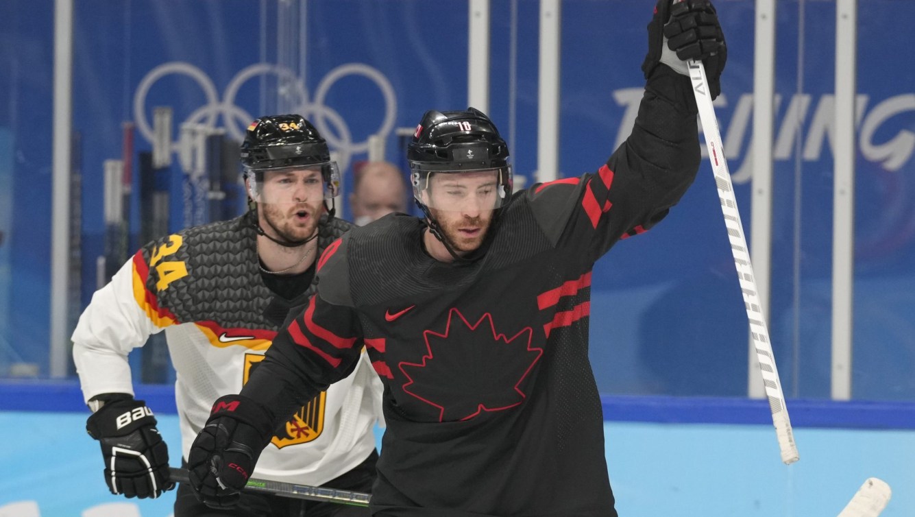 Ben Street raises his arm in celebration of a goal