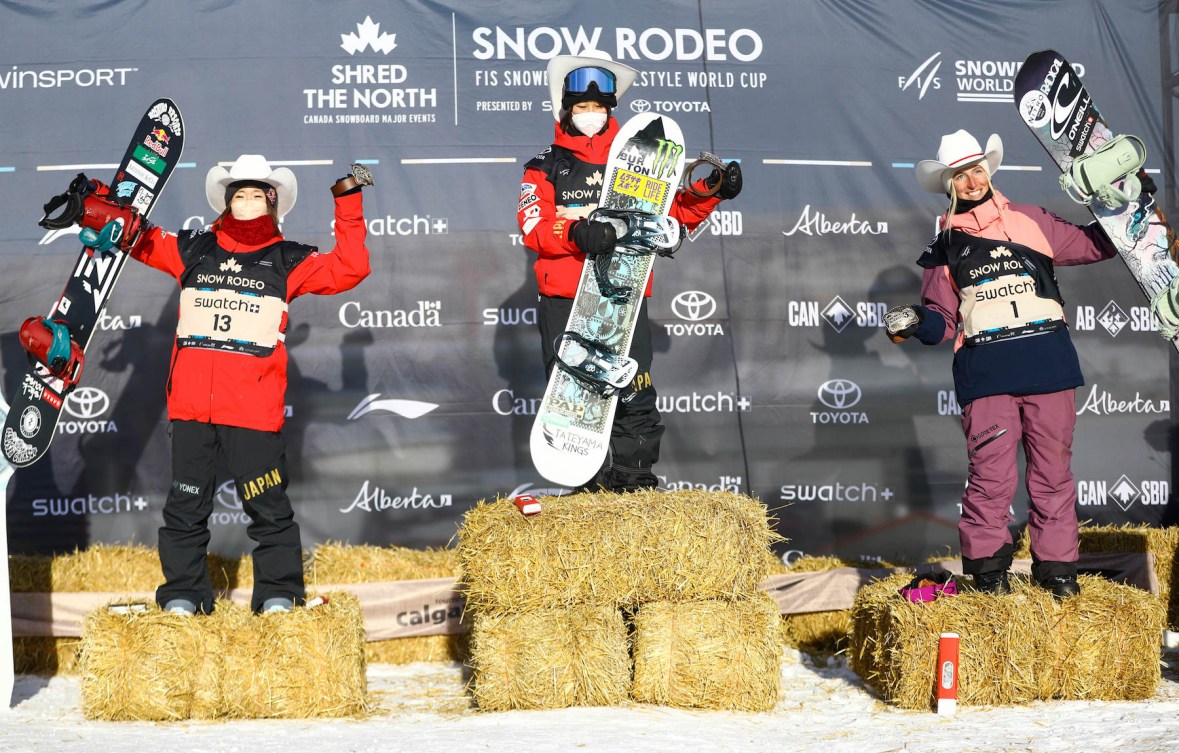 Japan’s Miyabi Onitsuka, left to right, Japan’s Kokomo Murase and Canada’s Laurie Blouin celebrate on the podium after the women's World Cup slopestyle snowboard event in Calgary, Alta., Saturday, Jan. 1, 2022.THE CANADIAN PRESS/Evan Buhler