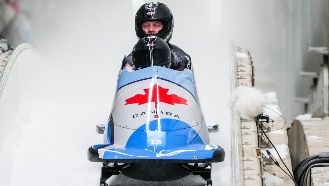 Daniel Sunderland raises his head at the back of the two-man bobsled at the finish