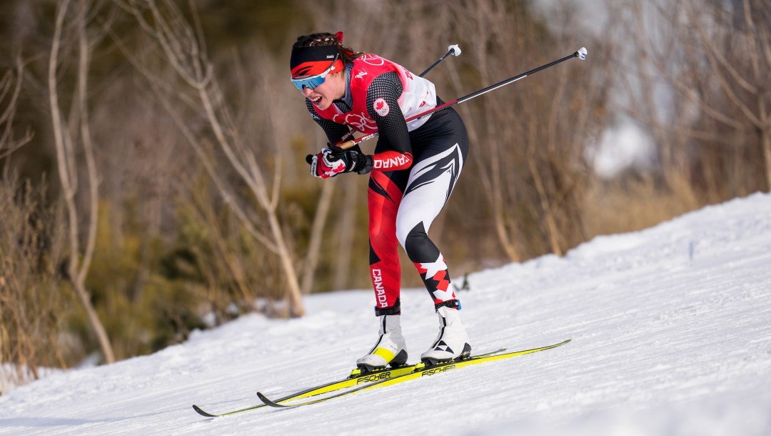 Katherine Stewart-Jones glides downhill during a cross country ski race