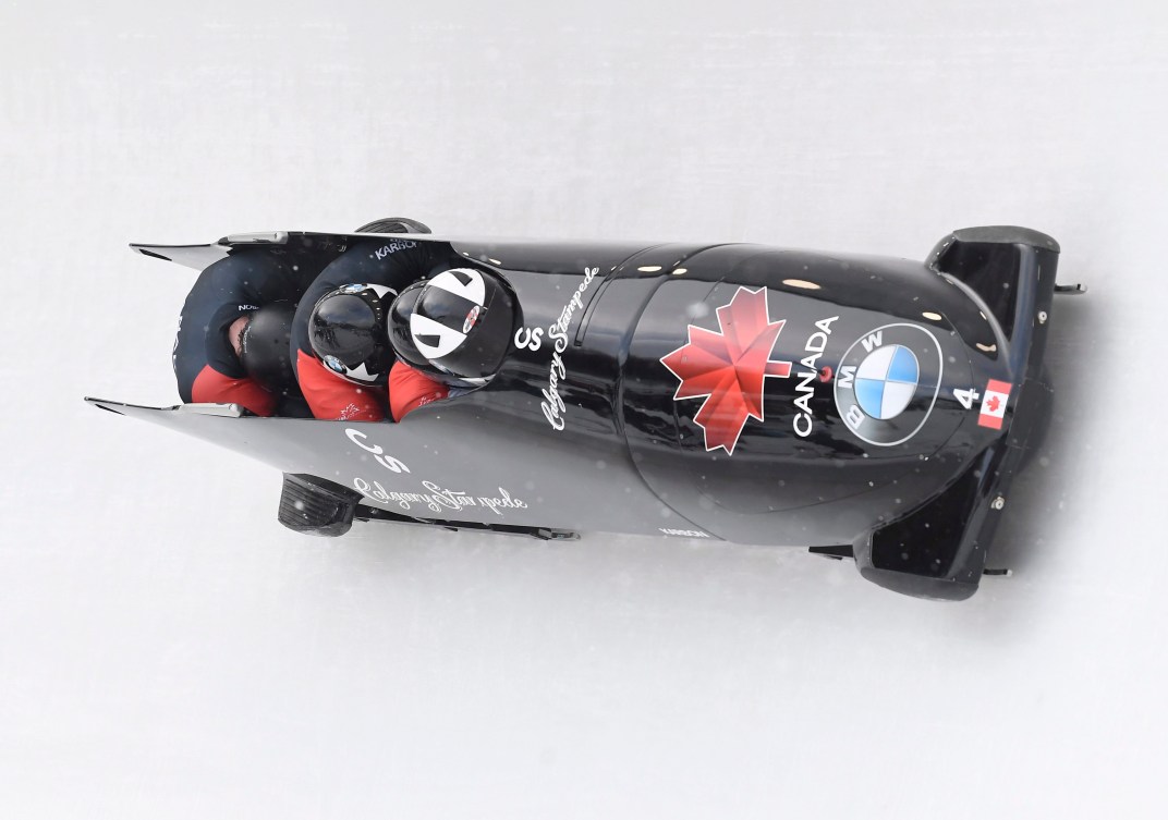 Driver Justine Kripps, Ryan Sommer, Cameron Stones and brakeman Benjamin Coakwell, of Canada, round a turn in the first run of the four-man bobsled World Cup Saturday, Feb. 16, 2019, in Lake Placid, N.Y. Canada won the event.