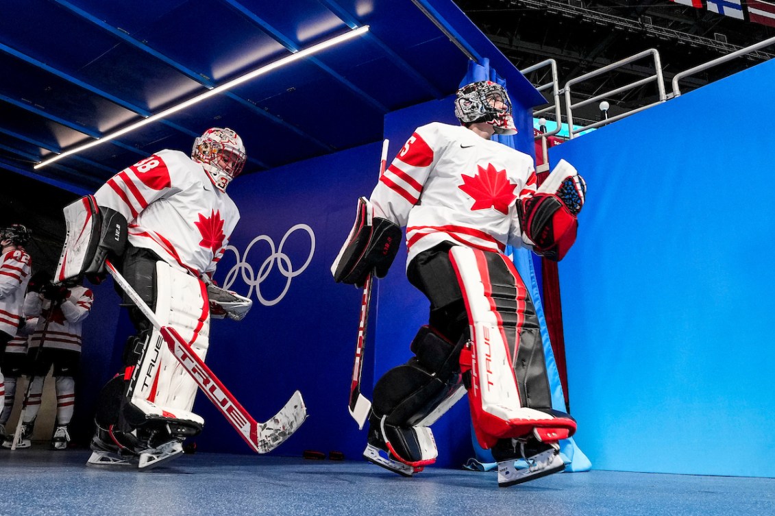 Emerance Maschmeyer #38 and teammate Ann-Renee Desbiens #35 of Team Canada walk to the start the first period at the Beijing 2022 Olympic Winter Games