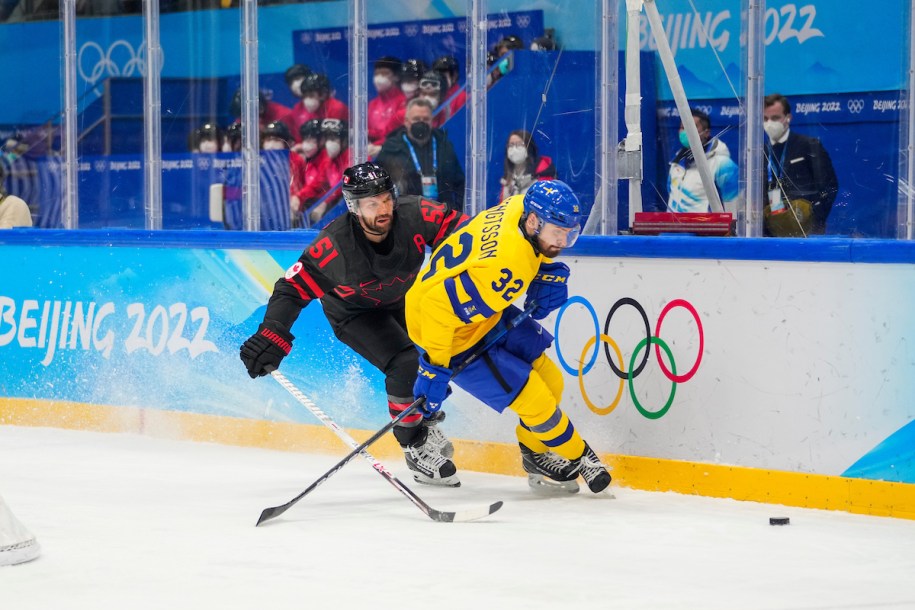 David Desharnais #51 of Team Canada battles for the puck agasitn Lukas Bengtsson #32 of Team Sweden
